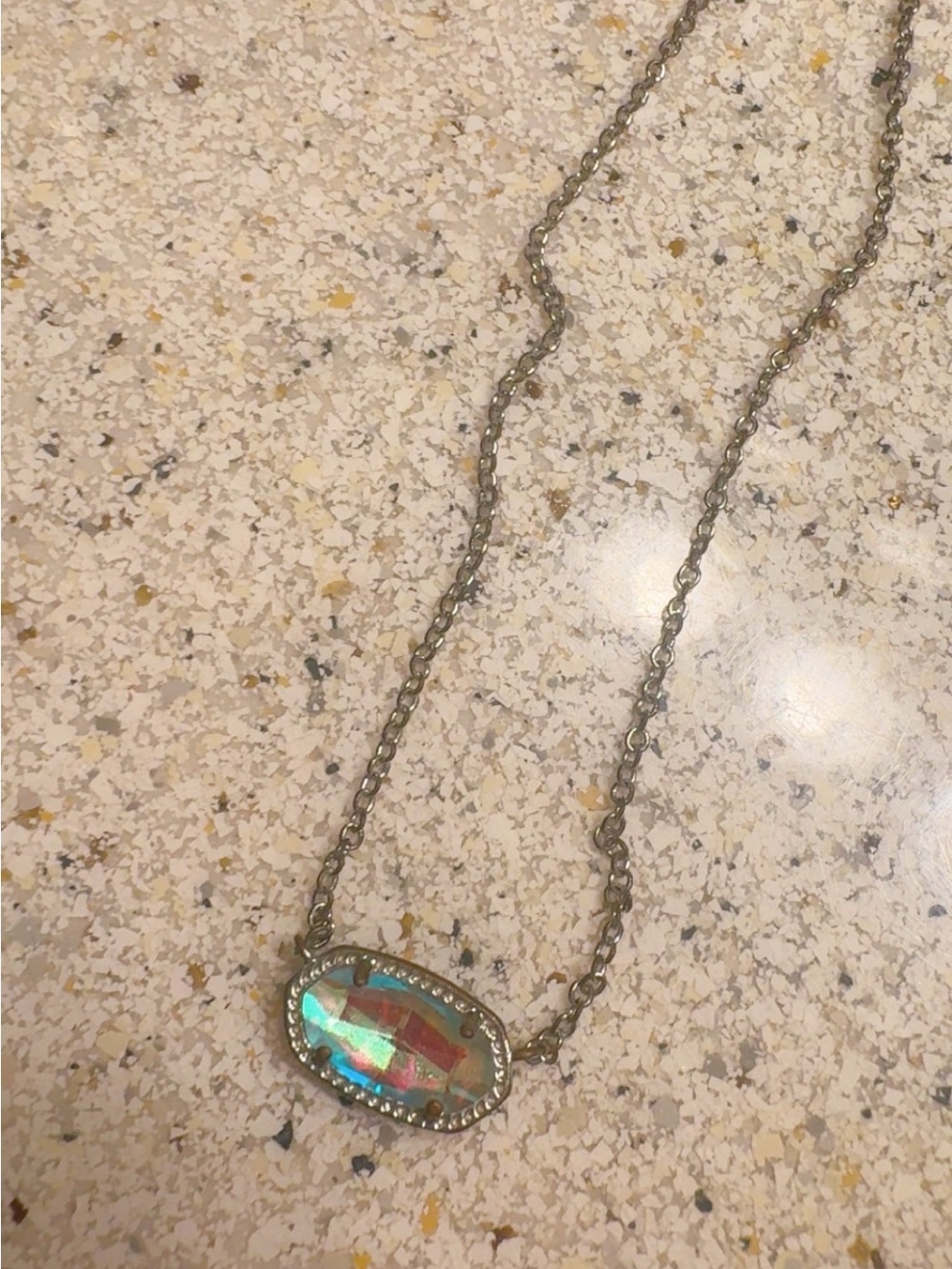 Silver Kendra Scott necklace with iridescent oval stone, just never wear